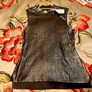 Sleeveless, mock turtleneck, knit top.